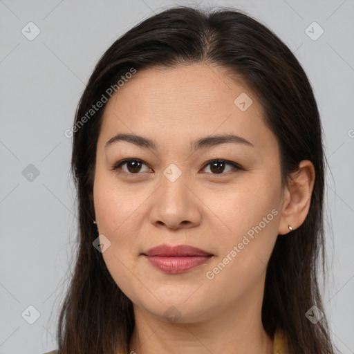 Joyful asian young-adult female with long  brown hair and brown eyes