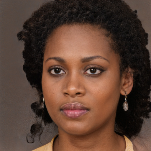 Neutral black young-adult female with long  black hair and brown eyes