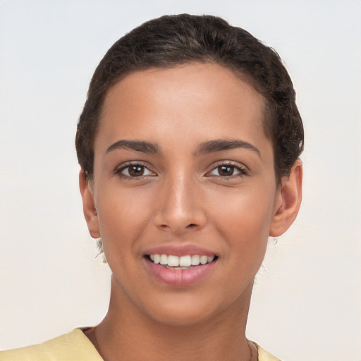 Joyful white young-adult female with short  brown hair and brown eyes