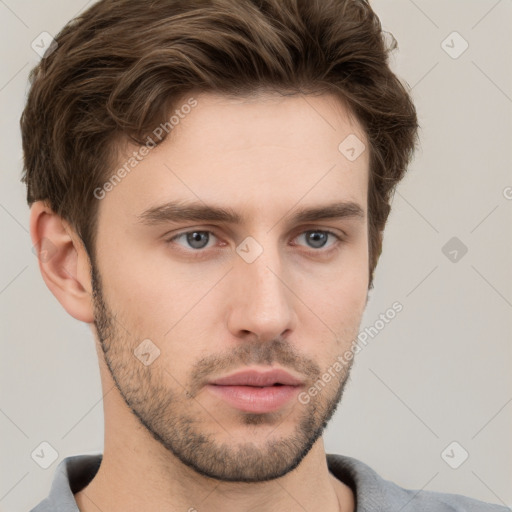 Neutral white young-adult male with short  brown hair and grey eyes