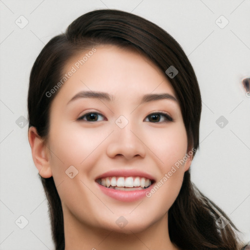 Joyful white young-adult female with long  black hair and brown eyes