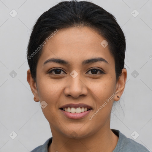 Joyful latino young-adult female with short  brown hair and brown eyes