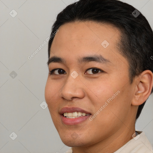 Joyful asian young-adult male with short  brown hair and brown eyes