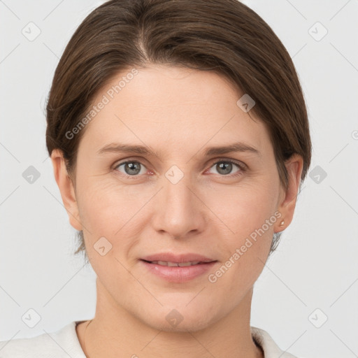 Joyful white young-adult female with short  brown hair and grey eyes