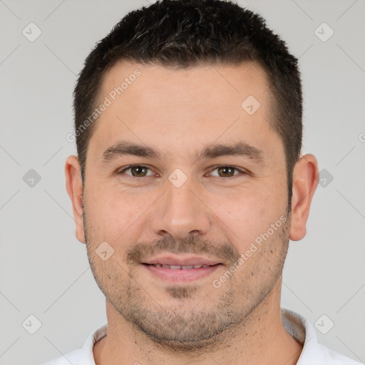 Joyful white young-adult male with short  brown hair and brown eyes