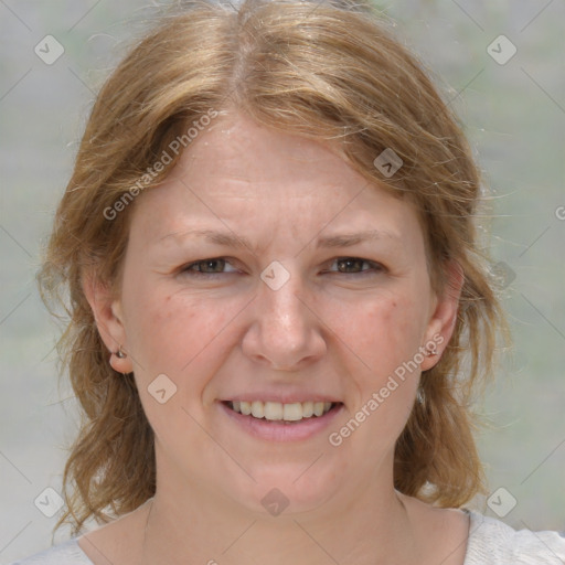 Joyful white adult female with medium  brown hair and grey eyes