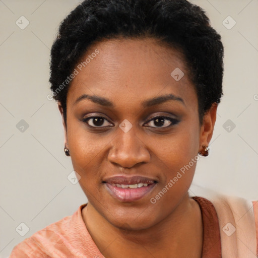 Joyful black young-adult female with short  black hair and brown eyes