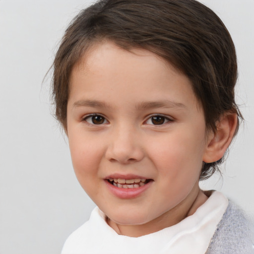 Joyful white child female with short  brown hair and brown eyes