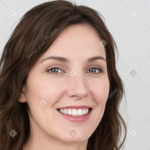 Joyful white young-adult female with long  brown hair and green eyes