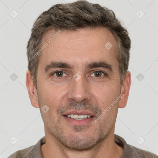 Joyful white adult male with short  brown hair and brown eyes