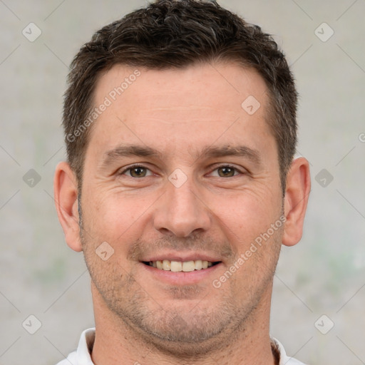 Joyful white adult male with short  brown hair and brown eyes