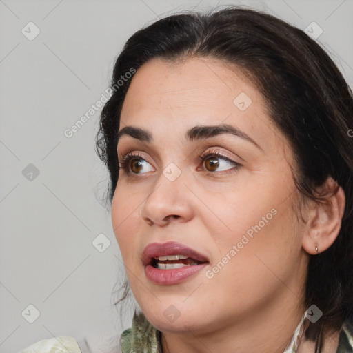Joyful white adult female with medium  brown hair and brown eyes