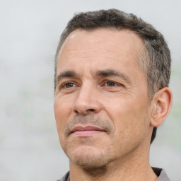 Neutral white adult male with short  black hair and brown eyes