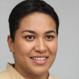 Joyful latino young-adult female with short  brown hair and brown eyes