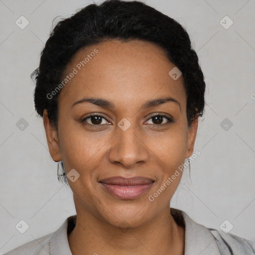 Joyful black adult female with short  black hair and brown eyes