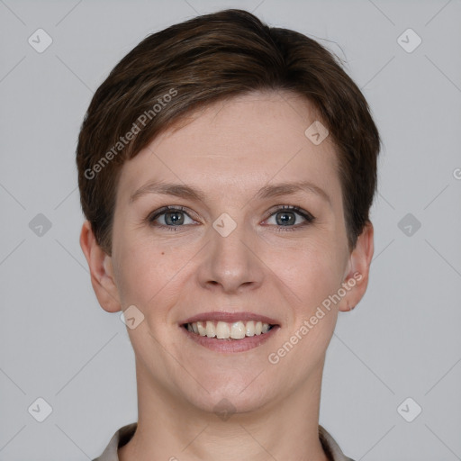 Joyful white young-adult female with short  brown hair and grey eyes