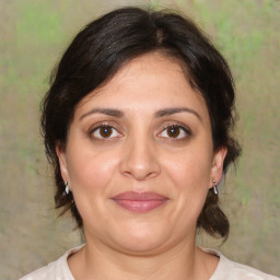 Joyful white adult female with medium  brown hair and brown eyes