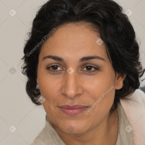 Joyful latino adult female with medium  brown hair and brown eyes