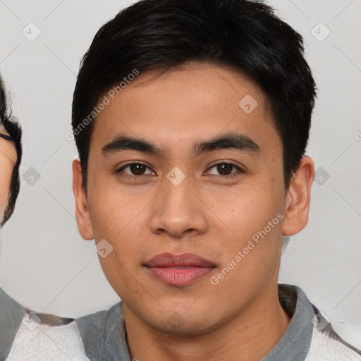 Joyful asian young-adult male with short  black hair and brown eyes