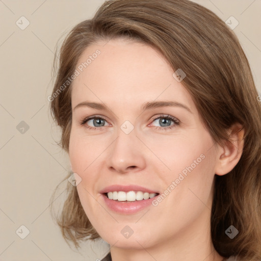 Joyful white young-adult female with medium  brown hair and green eyes