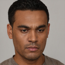 Neutral latino young-adult male with short  black hair and brown eyes