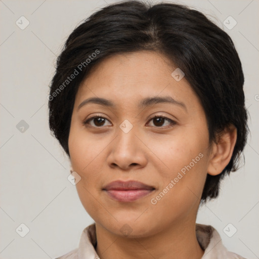 Joyful latino young-adult female with medium  brown hair and brown eyes