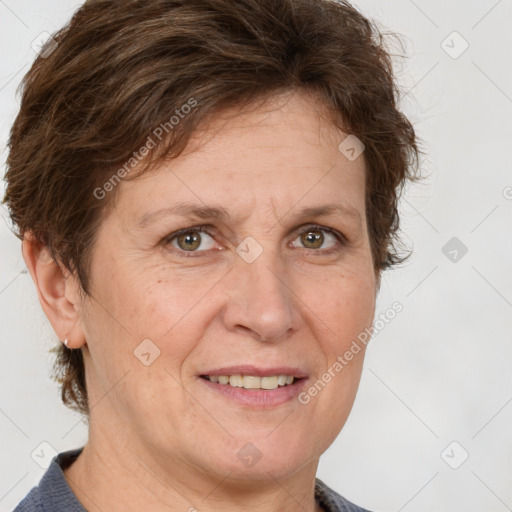 Joyful white adult female with short  brown hair and grey eyes