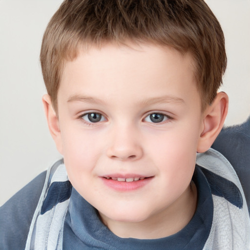 Joyful white child male with short  brown hair and brown eyes