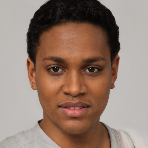 Joyful black young-adult female with short  black hair and brown eyes