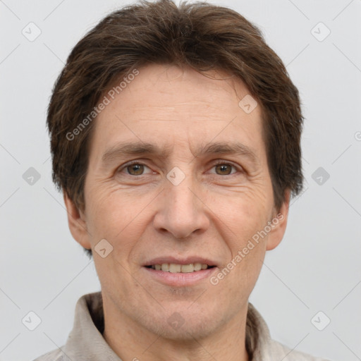 Joyful white adult male with short  brown hair and grey eyes