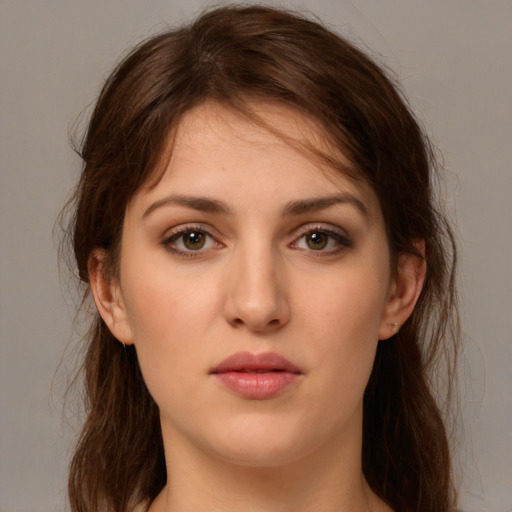 Neutral white young-adult female with long  brown hair and brown eyes