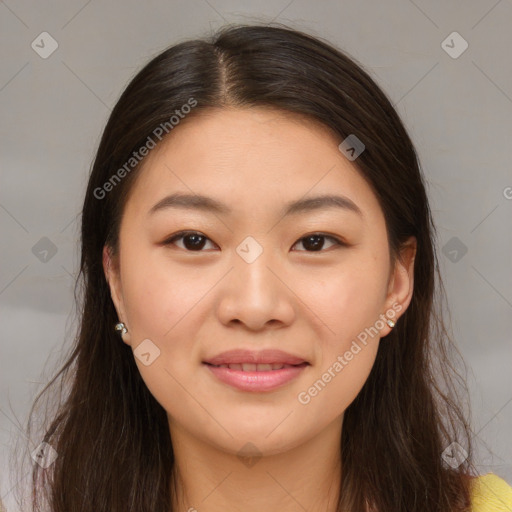 Joyful asian young-adult female with long  brown hair and brown eyes