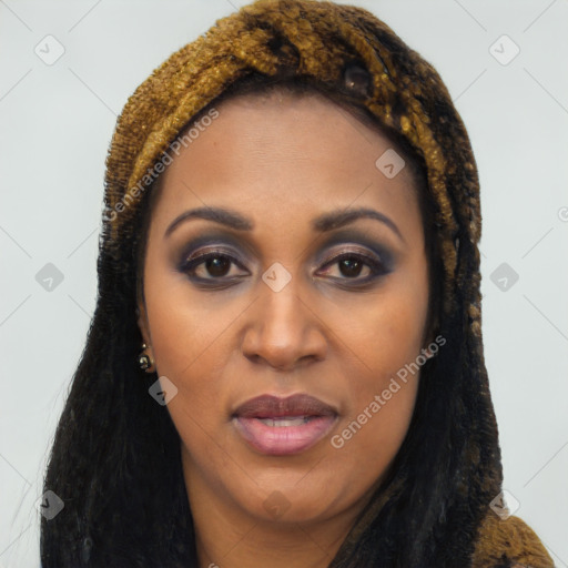 Joyful latino young-adult female with long  brown hair and brown eyes