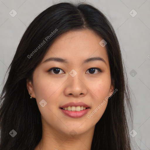 Joyful asian young-adult female with long  brown hair and brown eyes