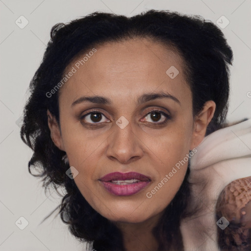 Joyful latino adult female with medium  brown hair and brown eyes