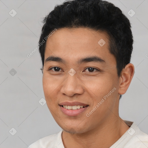 Joyful latino young-adult male with short  black hair and brown eyes