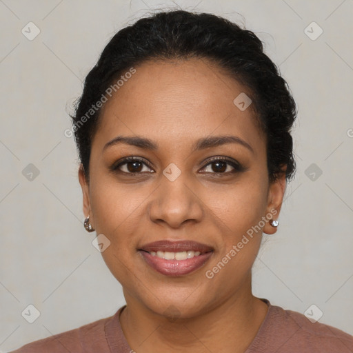 Joyful black young-adult female with short  black hair and brown eyes