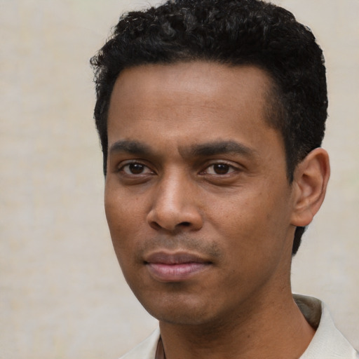 Neutral black young-adult male with short  black hair and brown eyes