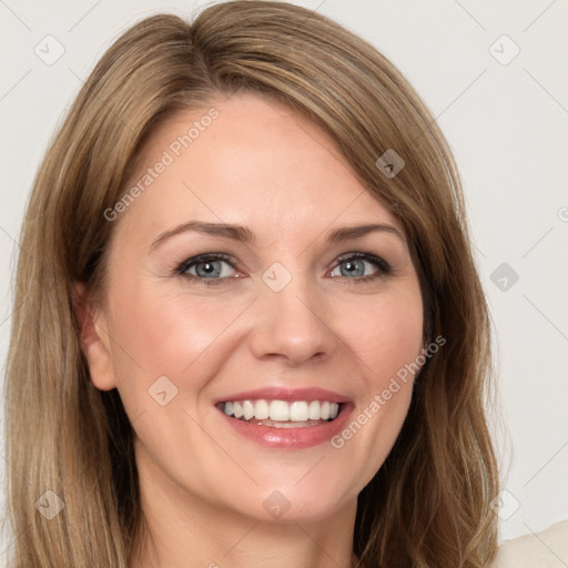 Joyful white young-adult female with long  brown hair and blue eyes