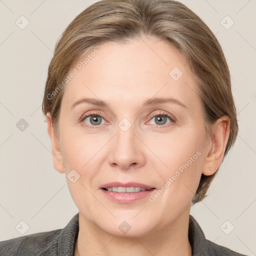 Joyful white adult female with short  brown hair and grey eyes