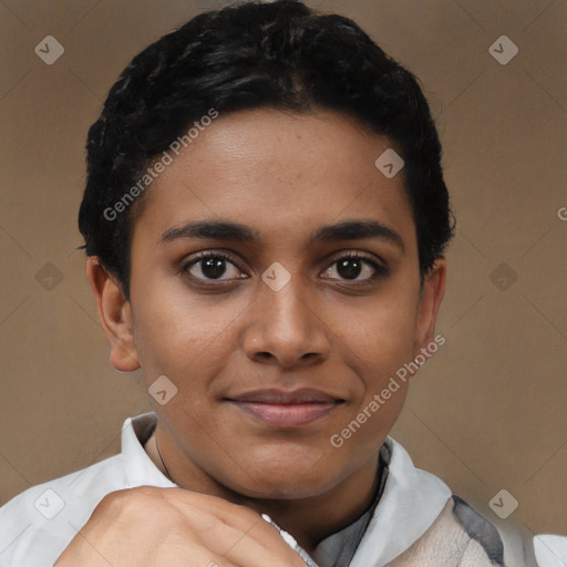 Joyful black young-adult female with short  black hair and brown eyes