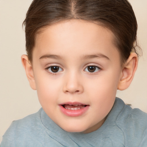 Joyful white child female with short  brown hair and brown eyes