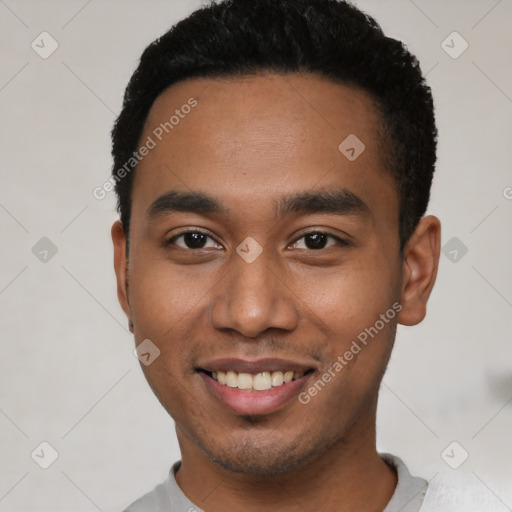 Joyful latino young-adult male with short  black hair and brown eyes