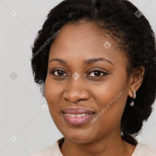 Joyful black young-adult female with medium  black hair and brown eyes