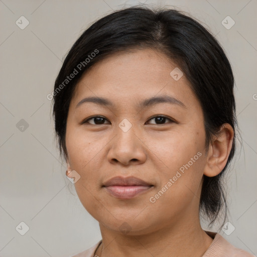 Joyful asian adult female with medium  brown hair and brown eyes