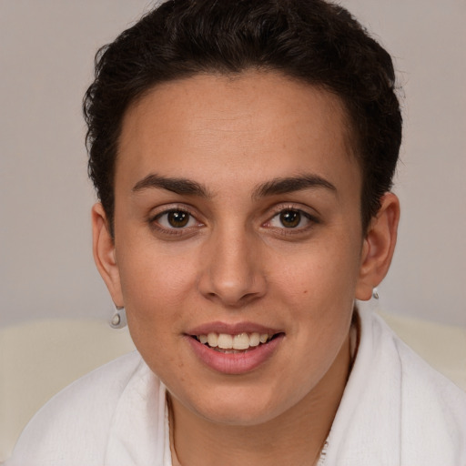 Joyful white young-adult female with short  brown hair and brown eyes