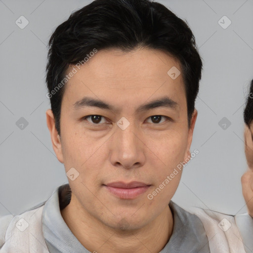 Joyful asian young-adult male with short  brown hair and brown eyes