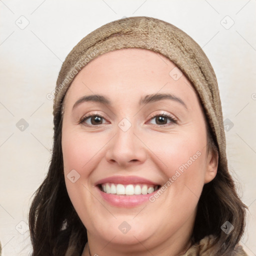 Joyful white young-adult female with long  brown hair and brown eyes