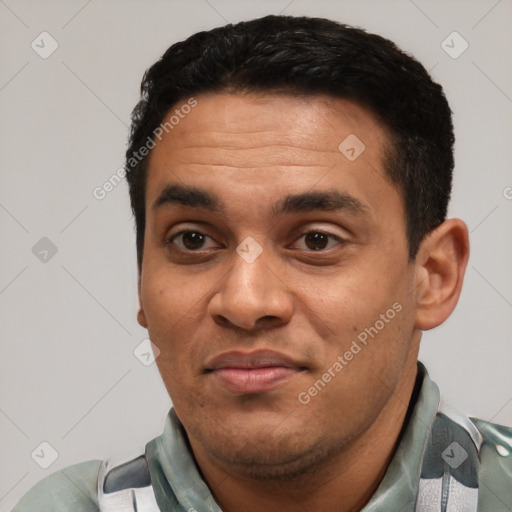 Joyful white young-adult male with short  black hair and brown eyes