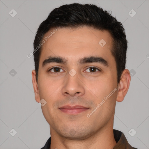 Joyful white young-adult male with short  black hair and brown eyes